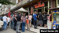 Nagorno-Karabakh - People line up outside a bakery in Stepanakert, July 18, 2023.