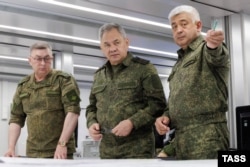 A photo released by the Russian Defense Ministry purported to show Defense Minister Sergei Shoigu (center) inspecting a military unit on June 26.