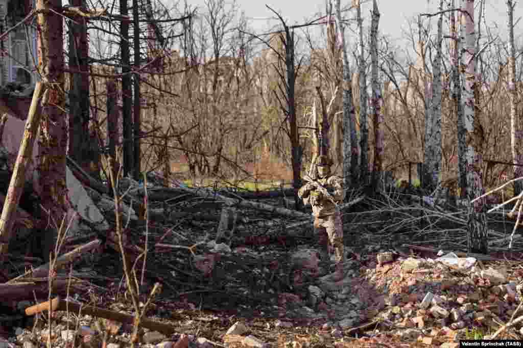 A mercenary with Russia&rsquo;s Wagner group in the ruins of a property in Bakhmut on April 10. Most Russian fighters in Bakhmut are from the Wagner mercenary group, many of whom are are hardened criminals recruited from Russia&#39;s prisons.&nbsp;