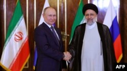 Глава Кремля Владимир Путин и президент Ирана Эбрахим Раиси