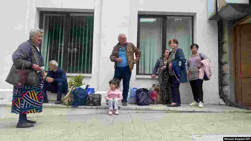 Local residents gather near a local government building after reports of shootings in Stepanakert. Separatists running the self-styled Republic of Artsakh -- as Nagorno-Karabakh is known by Armenians -- said they had been forced to agree to Azerbaijan&#39;s terms -- relayed by Russian peacekeepers -- after Baku&#39;s army broke through their lines and seized strategic locations. Azerbaijan had said it could no longer tolerate a situation it regarded as a threat to its security and territorial sovereignty.