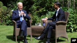 British Prime Minister Rishi Sunak (right) meets with U.S. President Joe Biden at 10 Downing Street in London on July 10.