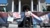 Belgrade -- LGBT+ young man is on a hunger strike due to police brutality in front of the Serbian Parliament, 15 April 2024