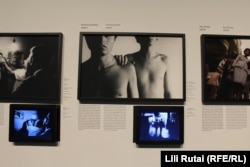 A photo titled Homosexuality (center) is cordoned off at the exhibit to prevent minors from viewing it, to conform with the government's "child protection" law.