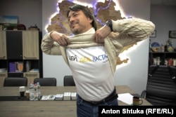 Serhiy Prytula, a former comedian and TV star who became one of Ukraine’s most famous fundraisers, shows off a T-shirt with the slogan “The time has come.”