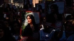 Protesters rally outside the Iranian Embassy in Istanbul on September 29, 2022. 
