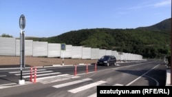 Armenia - A new wall and road built in the village of Kirants after the handover of adjacent land to Azerbaijan, August 20, 2024.