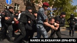 Armenia - Police detain a man during a protest against Azerbaijan's military action in the Nagorno-Karabakh, Yerevan, September 22, 2023.