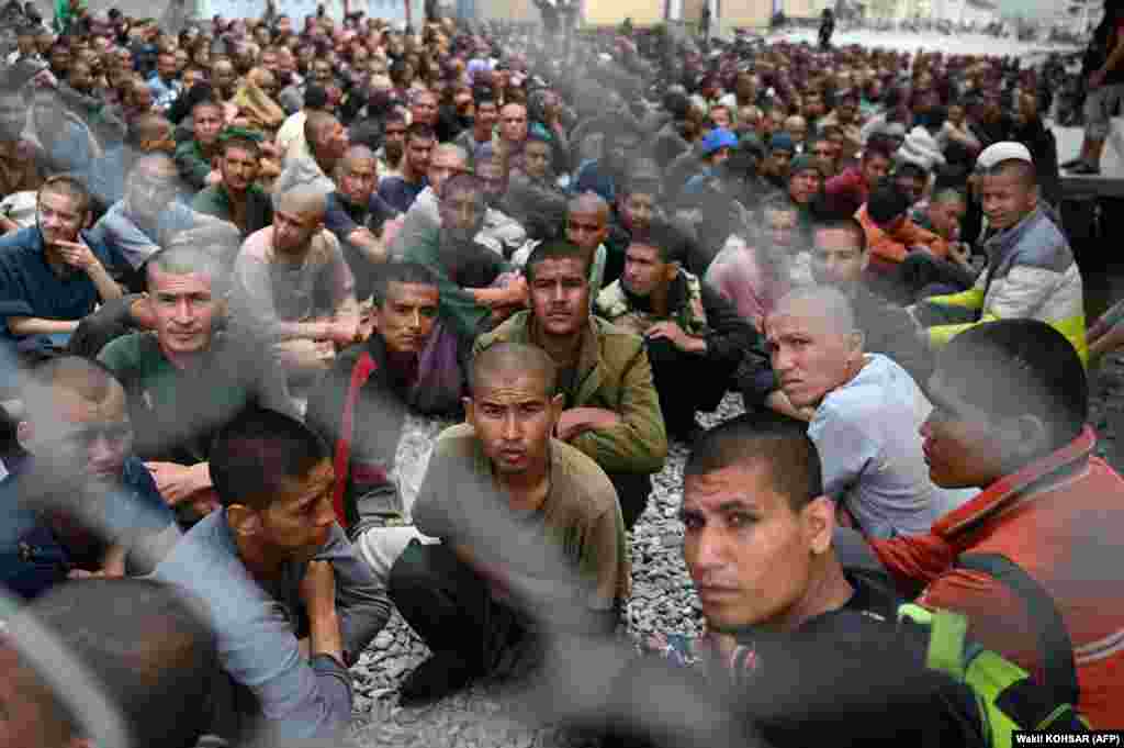 Afghan men gather inside the courtyard of a drug rehabilitation and treatment center on the outskirts of Kabul.&nbsp;