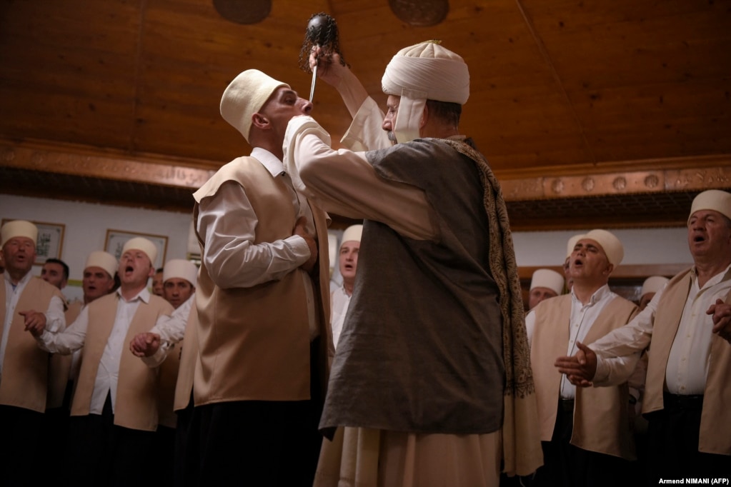 As his fellow Dervishes chant and sway to the hypnotic rhythm of prayer until reaching a trance-like state, a man has his neck pierced with long needles in the town of Gjakova, Kosovo. Considered a mystic sect by fellow Muslims in Kosovo and Albania, the dozens of Sufi Dervishes from the Kadiri order celebrate the centuries-old traditions of the spring equinox, known to them as Sultan Nevruz.