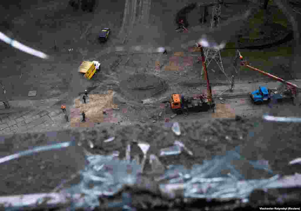 A large crater is visible from above near the site of damaged high-voltage lines that left residents in Kyiv on the east bank of the Dnieper River without power.