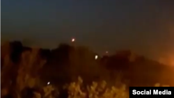 A social media video reportedly captures explosions near a military base in Iran believed to be Isfahan. Iranian news agency Fars said the flashes were antiaircraft guns working at very low altitude and that no air-defense missiles were launched.