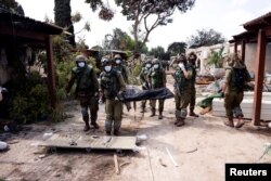 În chibuțul Kfar Aza, din sudul Israelului, soldații israelieni au găsit 40 de bebeluși uciși.