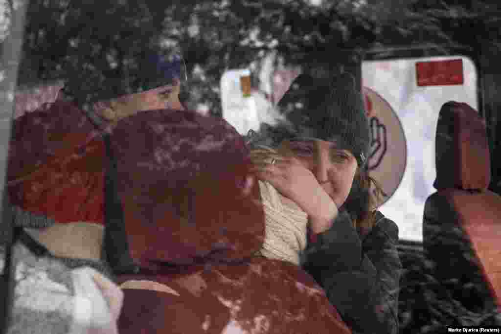 Iryna holds her mother&#39;s body after her sudden death.