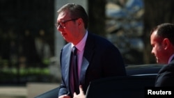 Serbian President Aleksandar Vucic walks out of a car on the day of the Ukraine Southeast Europe Summit in Tirana on February 28.