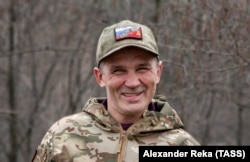 A volunteer Russian fighter near Kremmina, in Ukraine’s Luhansk region in March 2023, wears a cap that splices together Russian and Soviet symbols.