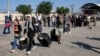 People enter Egypt via the Rafah border crossing in the southern Gaza Strip on November 1. 