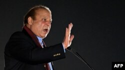 Former Pakistani Prime Minister Nawaz Sharif addresses his supporters during an event held to welcome him upon his return to Lahore on October 21. 