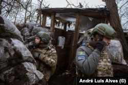 Maksym (right) volunteered to fight within a unit known as the Aidar Battalion and gained his first combat experience in Avdiyivka back in 2014.