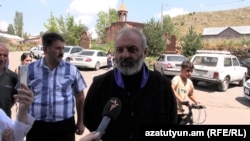 Archbishop Bagrat Galstanian, the leader of Armenia’s latest protest movement, talks to an RFE/RL Armenian Service correspondent while visiting the village of Sarnaghbyur, Shirak Province, on August 4, 2024.