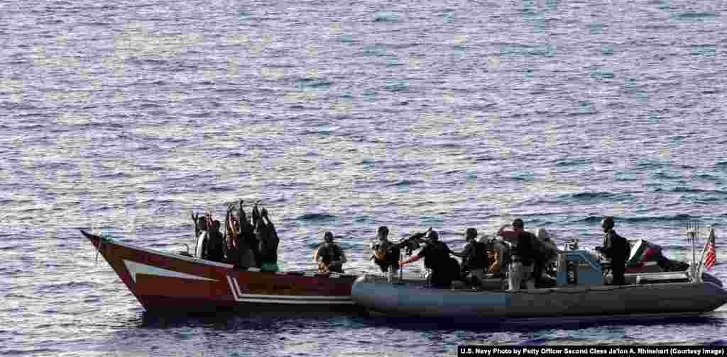 U.S. Coast Guards prepare to board a suspected pirate vessel in the Gulf of Aden in May 2010. NATO was also involved in the operation to crack down on piracy off the coast of Africa from 2008 to 2016. &nbsp;&nbsp;