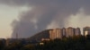 Smoke rises from the area in the direction of Avdiyivka as seen from Russian-occupied Donetsk.