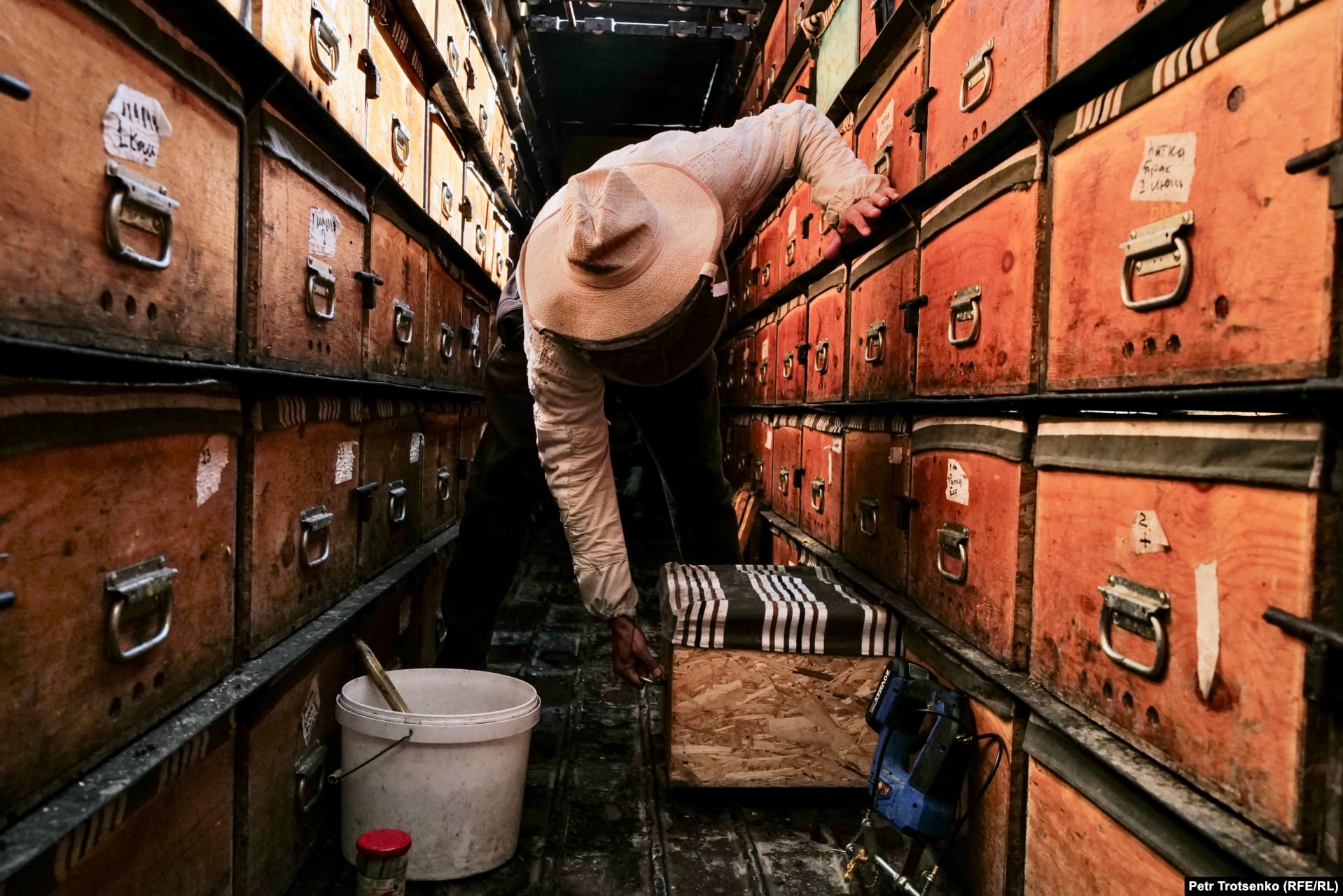 Tynychtyk Satarov works in his mobile apiary.