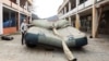 A worker prepares an inflatable decoy of a military vehicle during a media presentation in Decin, Czech Republic, on March 6.