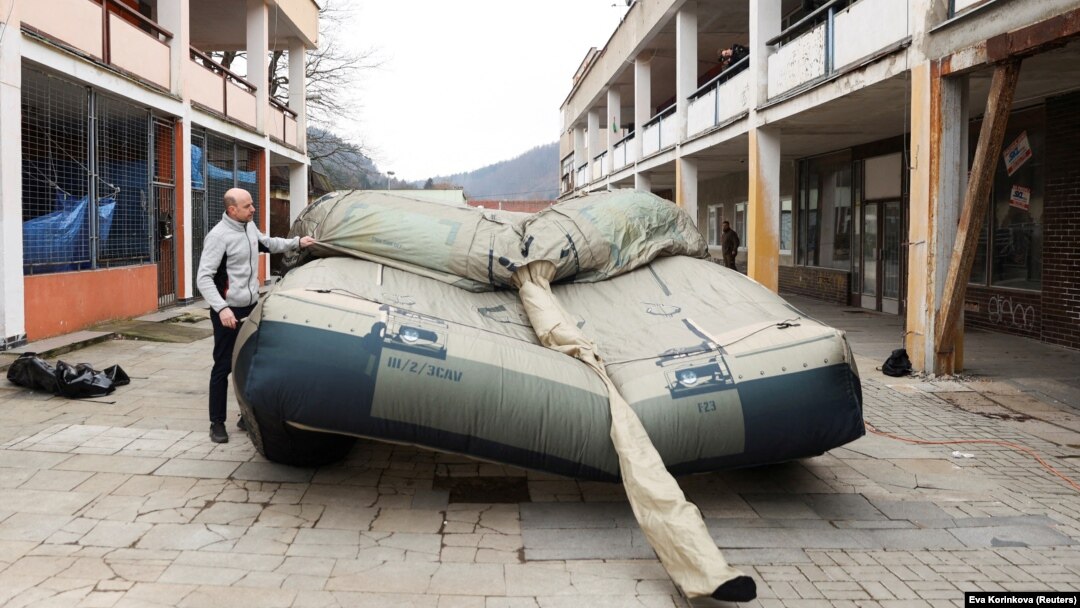 A worker prepares an inflatable decoy of a military vehicle during a media presentation in Decin, Czech Republic, on March 6.