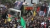 Iranians attend the funeral procession of Ismail Haniyeh in Tehran on August 1. 