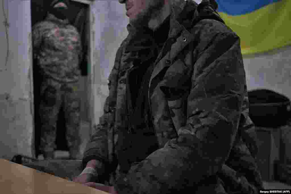 A member of the Wagner group waits in the interrogation room after being captured by Ukrainian soldiers near Bakhmut. Wagner founder Yevgeny Prigozhin described the situation in Bakhmut as &quot;tough, very tough,&quot; on March 10.&nbsp; &quot;The closer we are to the center of the city, the harder the fighting.... The Ukrainians throw in endless reserves. But we are advancing and we will be advancing,&quot; he said.&nbsp;