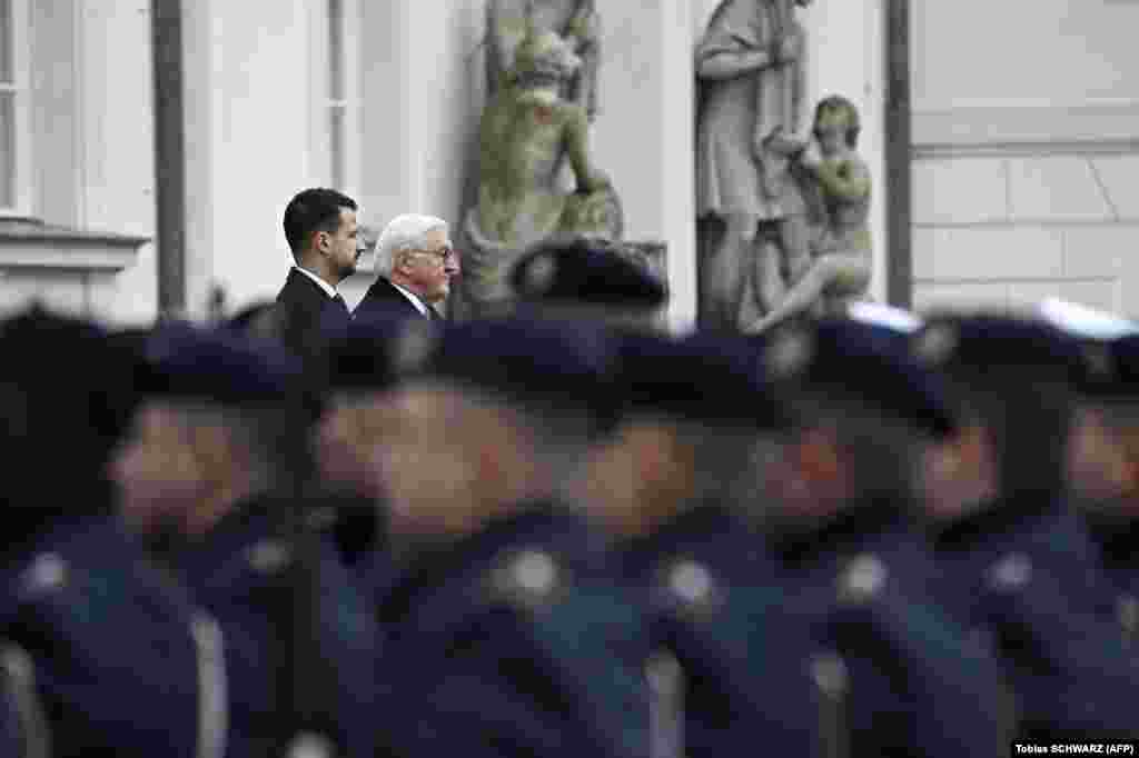 German President Frank-Walter Steinmeier (right) and Montenegrin President Jakov Milatovic review a military honor guard at the presidential Bellevue Palace in Berlin on November 21.