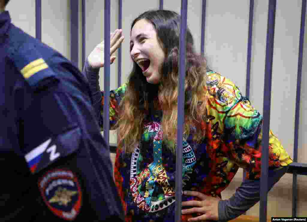 Sasha Skochilenko, a 33-year-old artist and musician charged with spreading false information about Russia&#39;s armed forces after replacing supermarket price tags with slogans protesting against the invasion of Ukraine, reacts inside an enclosure for defendants during a court hearing in St. Petersburg, Russia, on November 8.