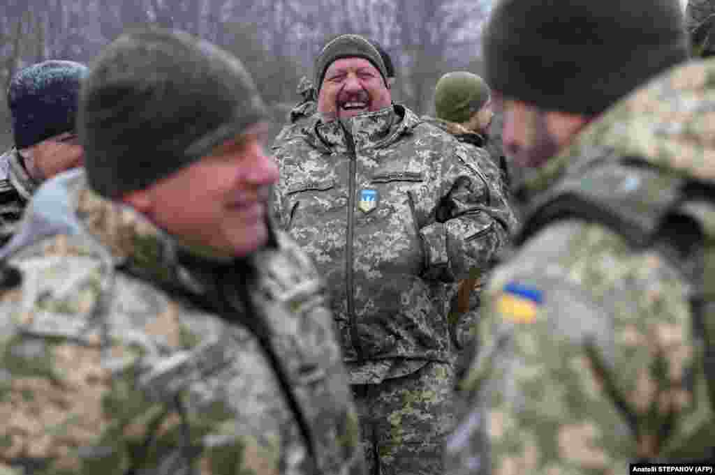 A Ukrainian soldier who took part in the defense of Kyiv laughs during the ceremony.&nbsp; &quot;Of course, we would like more missiles for Patriots and the systems themselves,&quot; Nayev said, referring to the larger U.S.-supplied surface-to-air missile systems that Kyiv claims were used to down 10 Kinzhal hypersonic ballistic missiles during the January 2 attack.