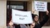 With signs reading "Secular state, where?" and "Does IVF in private hospitals destroy a family?," a group of activists protests in front of the Kosovo national assembly on February 29 against deputies who are dragging their feet over a draft bill that would grant women access to in vitro fertilization treatment. 