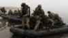 UKRAINE – A group of Ukrainian marines sail from the riverbank of Dnipro at the frontline near Kherson, October 14, 2023