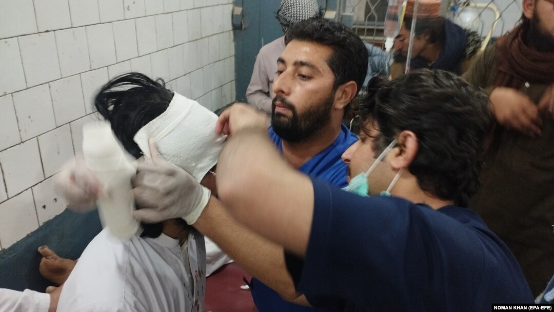People who were injured in a blast receive medical treatment at a hospital in Bannu, Pakistan, on November 26.