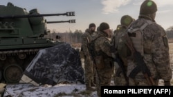 Ukrainian soldiers of a drone-hunting team are seen on the outskirts of Kyiv on November 30. 