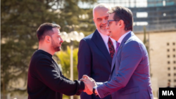 Ukrainian President Volodymyr Zelenskiy (left) shakes hands with Macedonian President Stevo Pendarovski as Albanian Prime Minister Edi Rama looks on in Tirana on February 28.