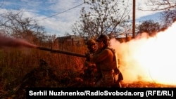 Ukrainian soldiers fire on Russian positions near Avdiyivka in eastern Ukraine on November 8.