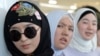 Kyrgyz women hijab look on as they take part in celebrations for World Hijab Day in Bishkek.  Kyrgyzstan is the only Central Asian country that has not officially banned the hijab, although the issue is a matter of debate there. (file photo) 