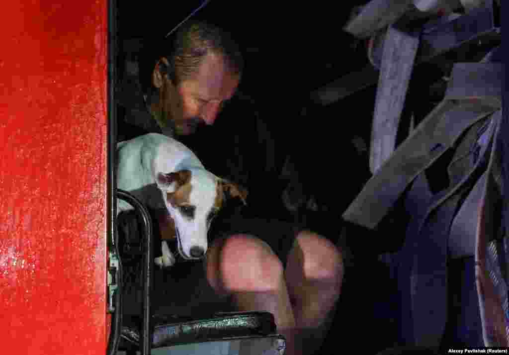 A man and a dog are rescued from the flooding in Yevpatoria.