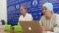 Members of the unregistered Naghyz Atazhurt party Turarbek Asylbekov (left) and Nazigul Maqsutkhan attend a press conference in Almaty on August 7.