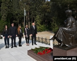The first family visits the tomb of patriarch Heydar Aliyev in May 2023.