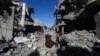 Գազայի հատված - Պաղեստինցիները Կուզա քաղաքի ավերակ դարձած շենքերի փլատակների վրա, 29-ը նոյեմբերի, 2023թ.