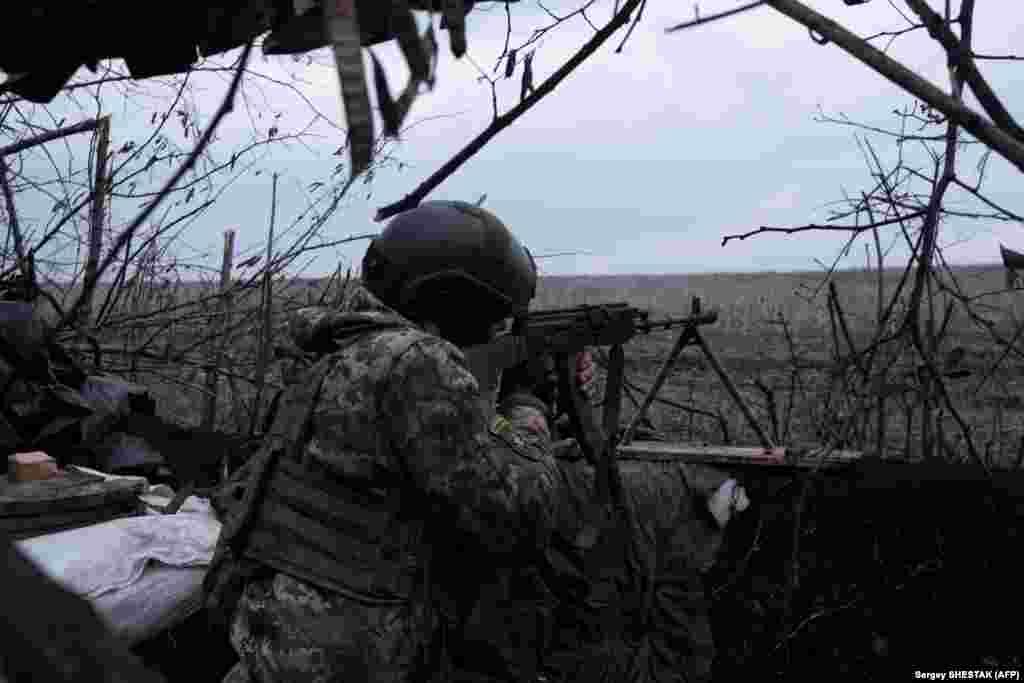 Another soldier takes aim at Russian positions.