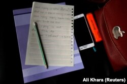 The notebook of a trainee midwife during a training class in Bamiyan.