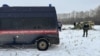 Investigators at the crash site where a Russian Il-76 plane came down near Belgorod on January 24. 