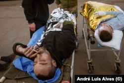 At a triage site near Avdiyivka in early December, the wounded come in waves -- sometimes dozens of soldiers in a single day.