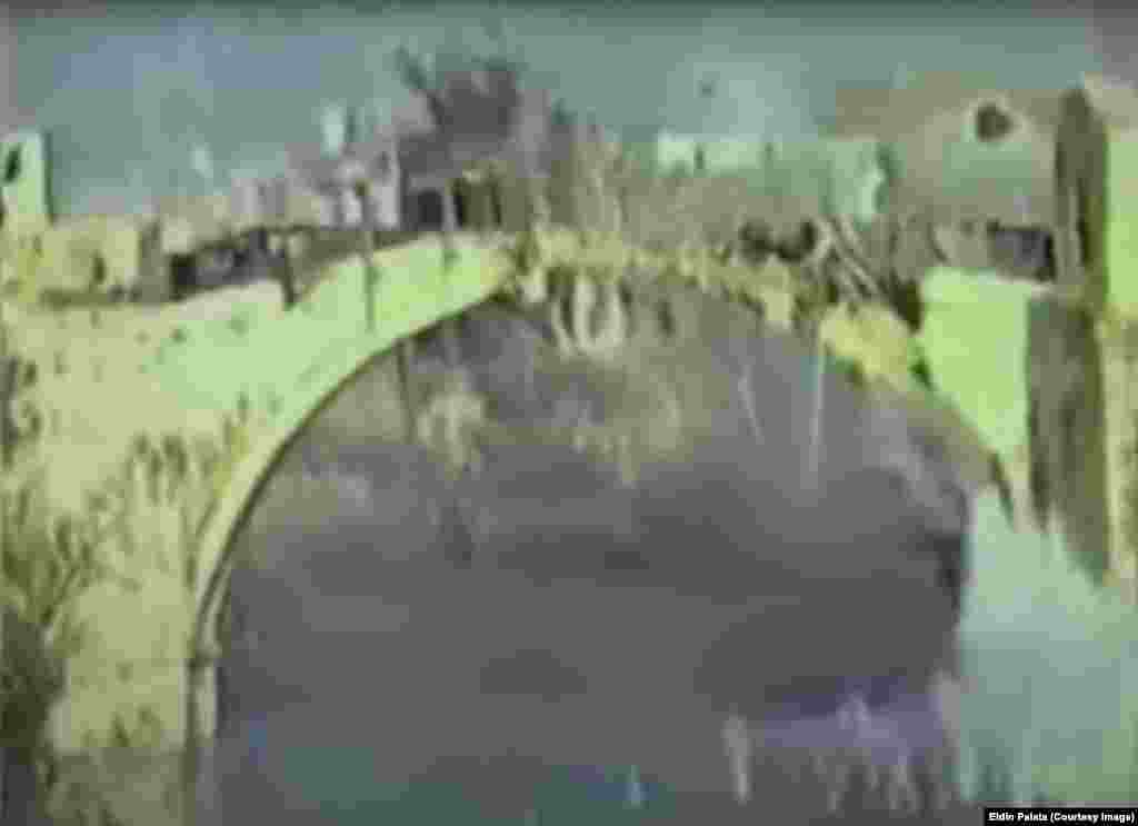 Кадър от видео показва момента, в който мостът започва да се срутва, след като е ударен от снаряд сутринта на 9 ноември 1993 г. В 10:16 ч на 9 ноември Елдин Палата, 17-годишен жител на Мостар, заснема на видео момента, в който мостът е ударен от снаряд, който &nbsp;запраща конструкцията в река Неретва.